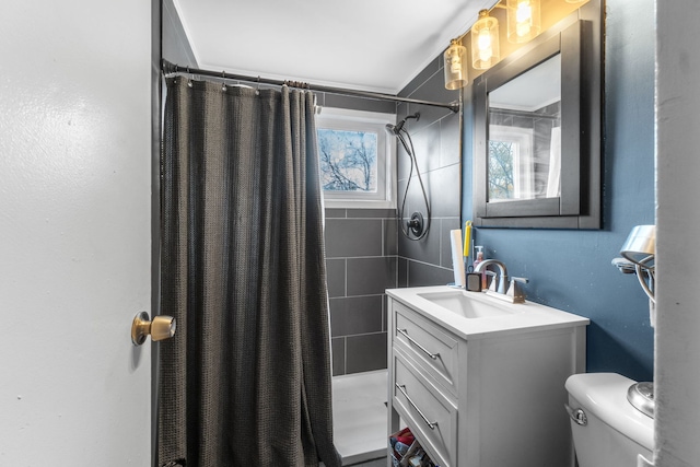 bathroom with a shower with curtain, vanity, and toilet