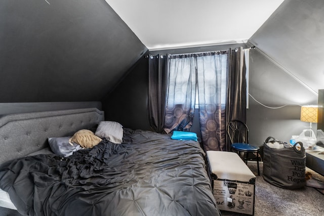 bedroom featuring carpet floors and vaulted ceiling