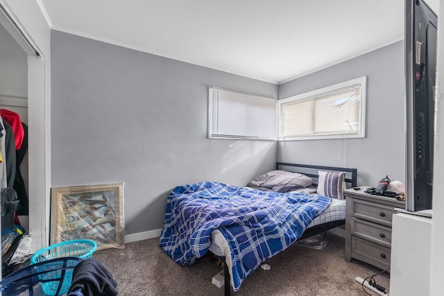 bedroom with carpet and crown molding