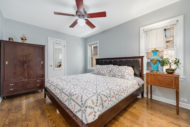 bedroom with hardwood / wood-style floors and ceiling fan