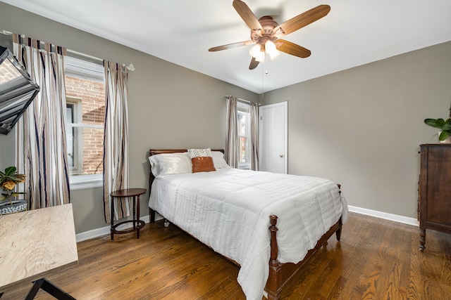 bedroom with ceiling fan and dark hardwood / wood-style floors