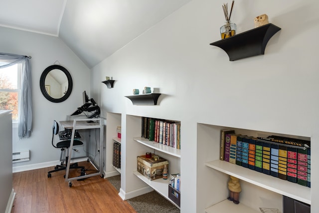 office space featuring hardwood / wood-style floors, a baseboard radiator, and lofted ceiling