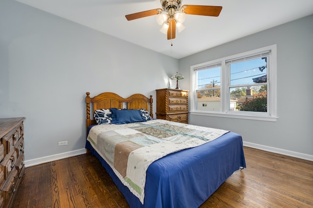 bedroom with ceiling fan and dark wood-type flooring