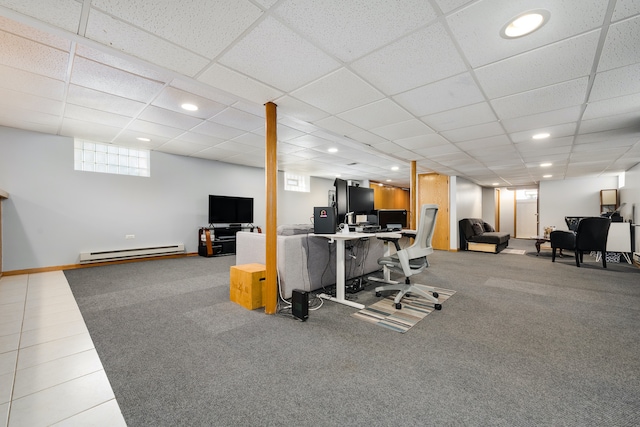 workout area with carpet, a drop ceiling, and a baseboard heating unit