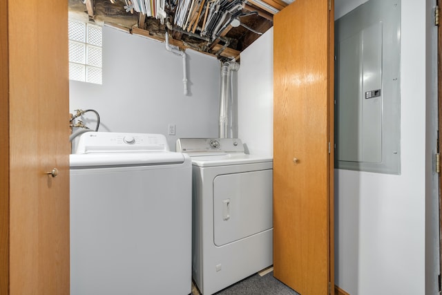 washroom featuring washer and clothes dryer and electric panel