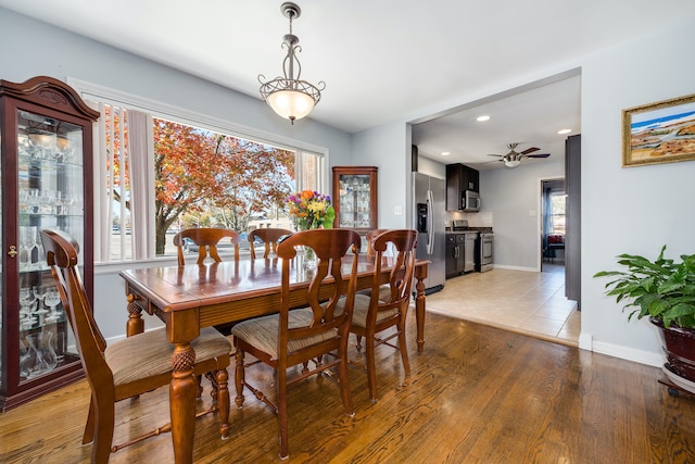 dining room featuring ceiling fan and hardwood / wood-style floors