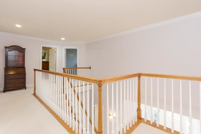 hallway with carpet and crown molding