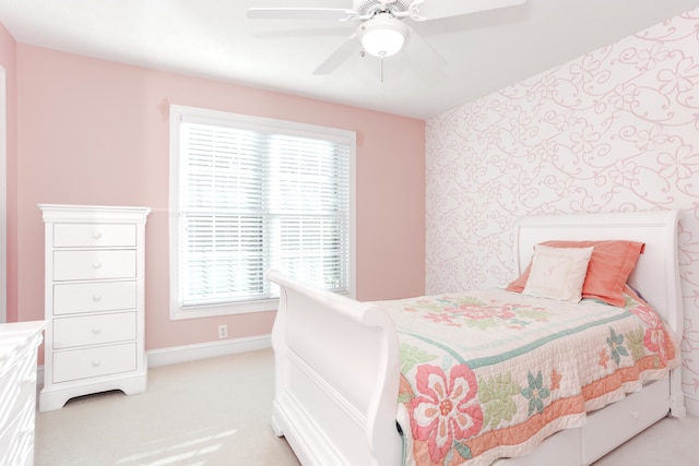 carpeted bedroom with multiple windows and ceiling fan