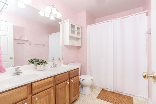 bathroom with a shower with curtain, vanity, and toilet