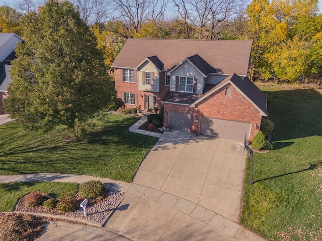 view of front of house featuring a garage and a front lawn