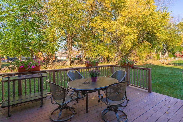 wooden terrace with a yard