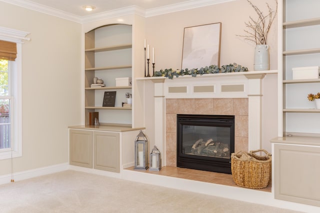 carpeted living room with a tiled fireplace and crown molding