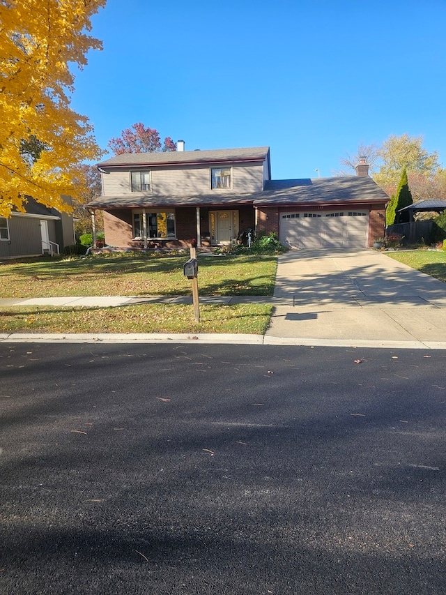 view of front facade featuring a front lawn and a garage