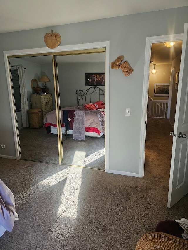 carpeted bedroom with a closet