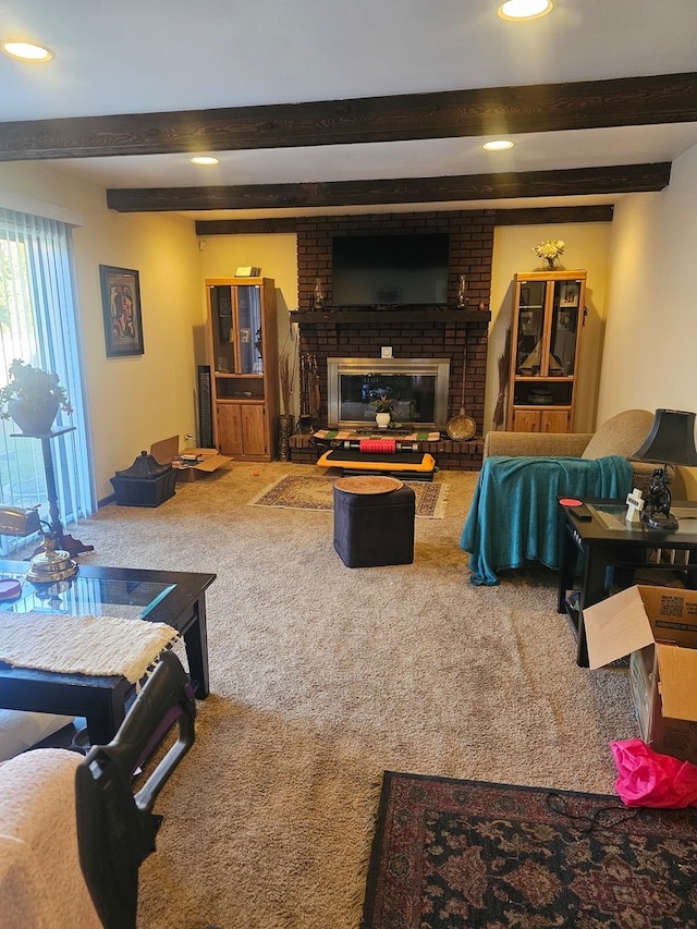 carpeted living room with a brick fireplace and beam ceiling