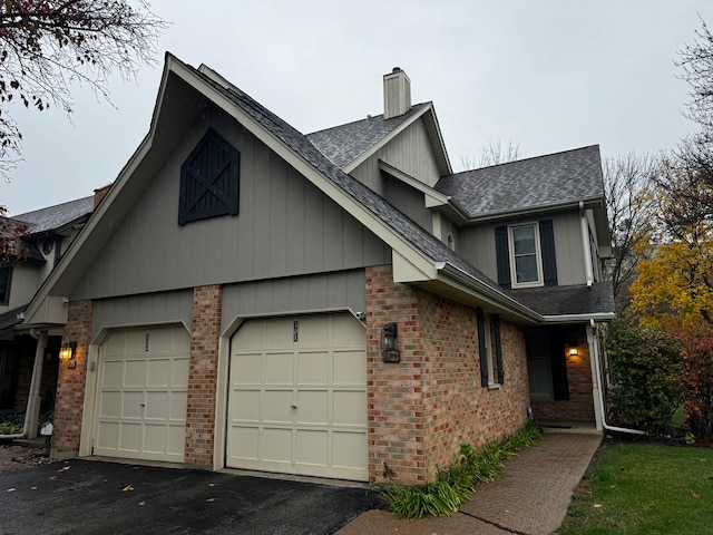 view of side of property with a garage