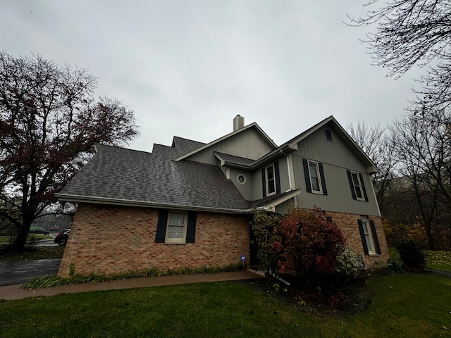 view of property featuring a front lawn