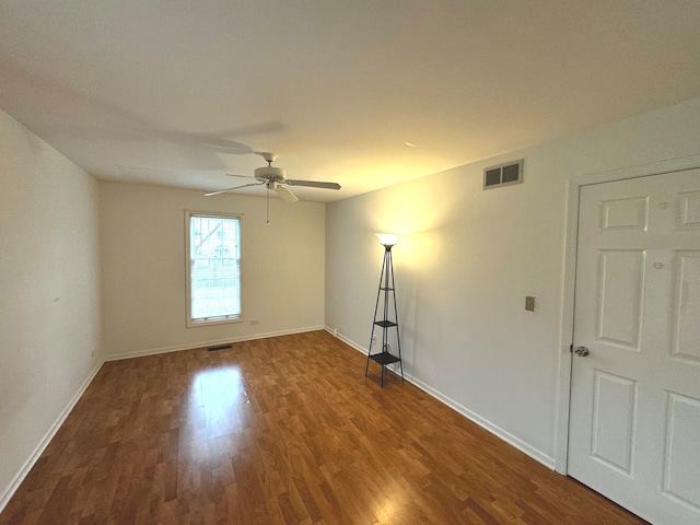 unfurnished room featuring hardwood / wood-style floors and ceiling fan