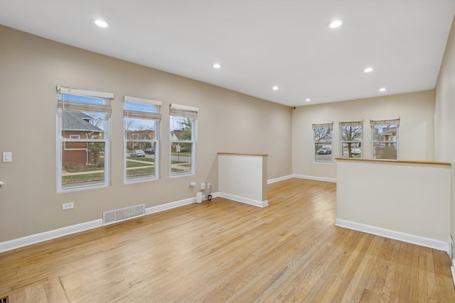 unfurnished room featuring light hardwood / wood-style floors