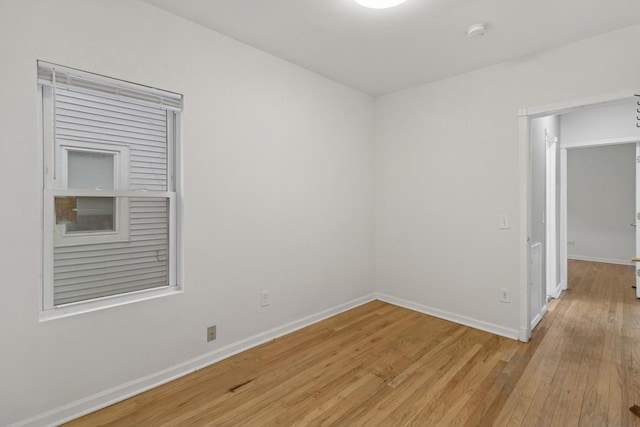 spare room featuring light hardwood / wood-style floors