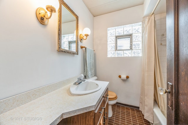 full bathroom featuring tile patterned floors, vanity, toilet, and shower / tub combo with curtain