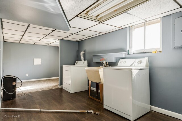 laundry room with dark hardwood / wood-style flooring and washing machine and clothes dryer