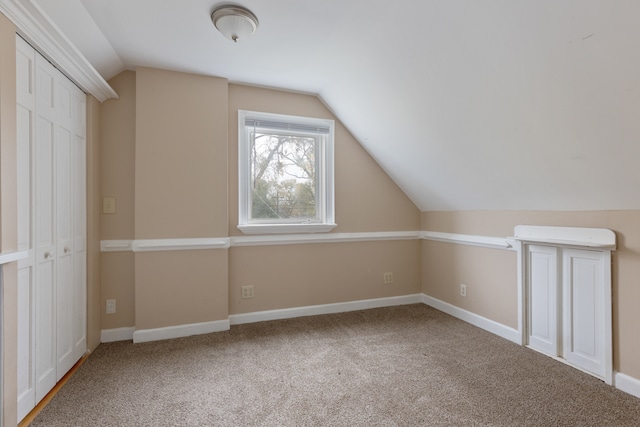 bonus room with carpet and lofted ceiling