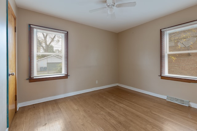 unfurnished room featuring light wood-type flooring and ceiling fan