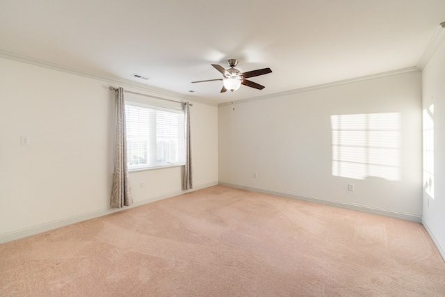 unfurnished room featuring ceiling fan, light carpet, and crown molding