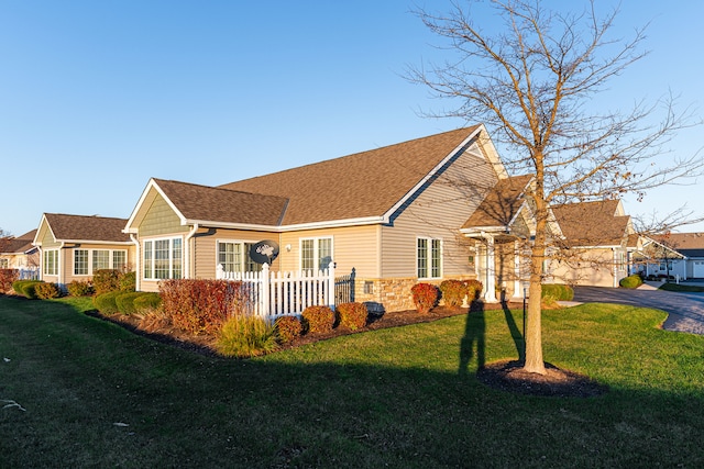 view of property exterior with a garage and a yard