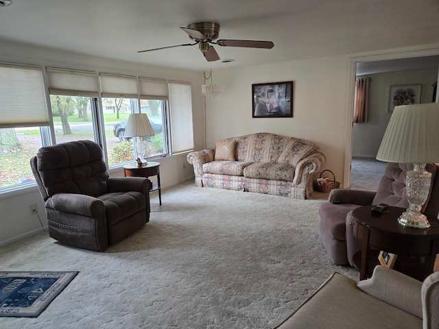 carpeted living room featuring ceiling fan