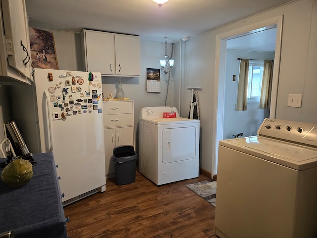 laundry area with dark wood-type flooring and independent washer and dryer