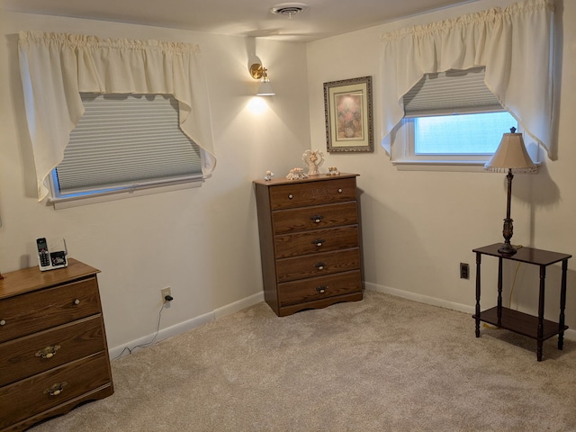 bedroom featuring light carpet