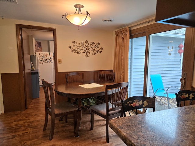 dining space with dark wood-type flooring