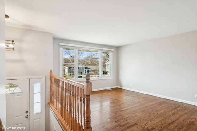 foyer entrance featuring wood-type flooring