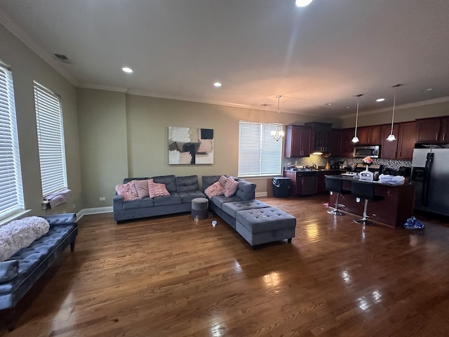 living room featuring dark hardwood / wood-style floors and crown molding