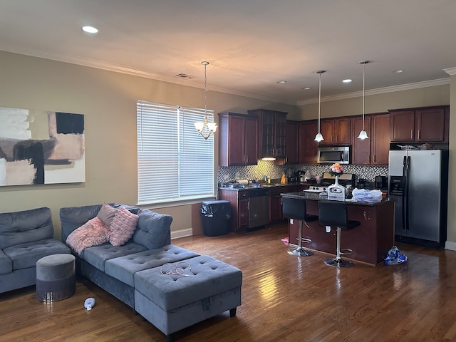 living room featuring crown molding, sink, and dark hardwood / wood-style flooring