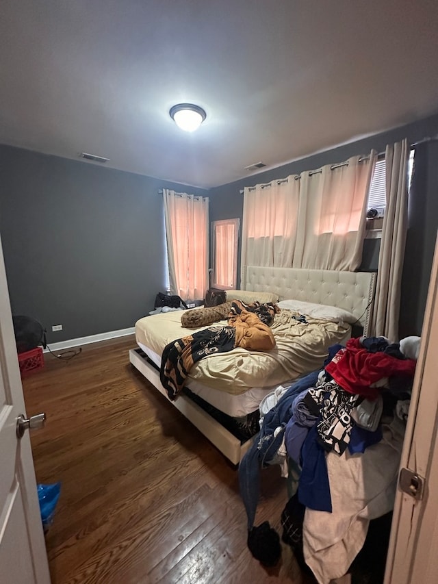 bedroom featuring dark wood-type flooring