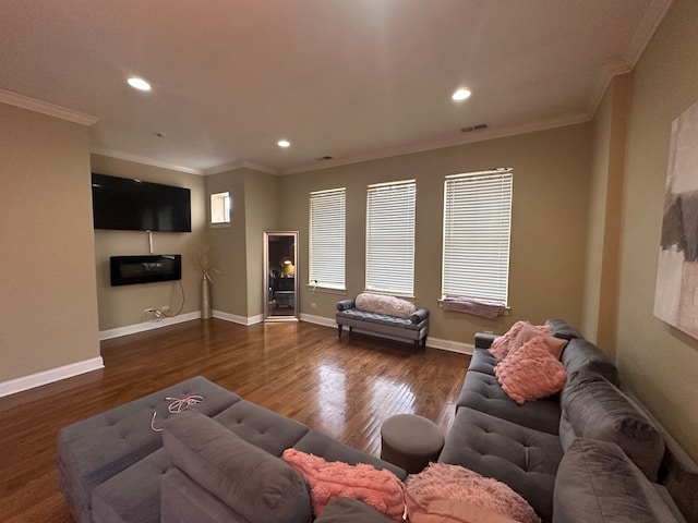 living room with dark hardwood / wood-style flooring and crown molding