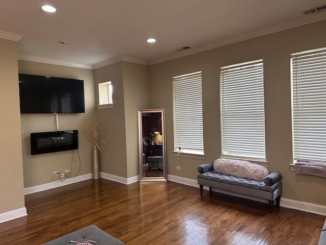 sitting room featuring dark hardwood / wood-style floors and crown molding