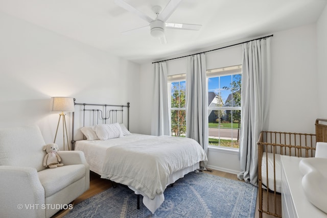 bedroom featuring ceiling fan and wood-type flooring