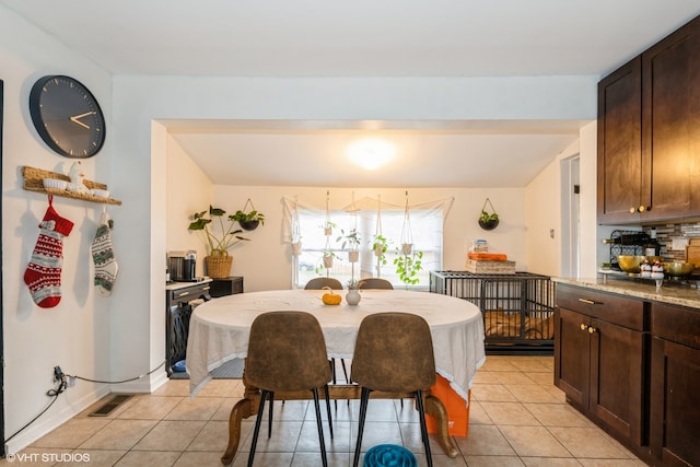 dining space with light tile patterned floors