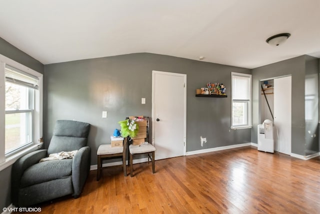1316 S 8th Ave, Maywood, IL 60153 - sitting room featuring wood finished floors, lofted ceiling, and baseboards