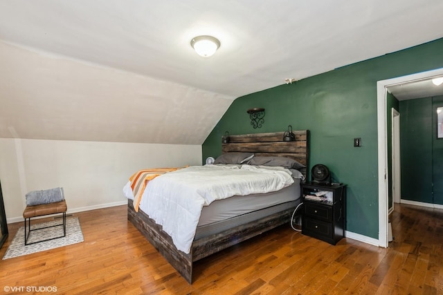 1316 S 8th Ave, Maywood, IL 60153 - bedroom with lofted ceiling, wood finished floors, and baseboards