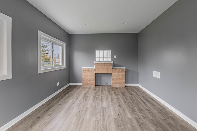 unfurnished office featuring light wood-type flooring