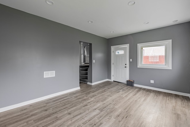 entryway with light hardwood / wood-style flooring