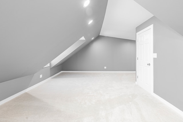 bonus room featuring carpet flooring and lofted ceiling