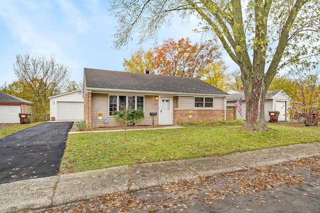 ranch-style house with a garage and a front yard