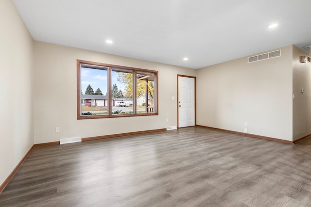 empty room featuring hardwood / wood-style flooring