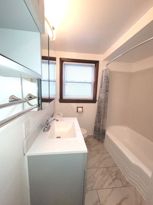 full bathroom featuring toilet, vanity, and shower / bathtub combination with curtain